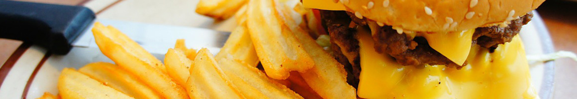 Eating Burger at Burger Island restaurant in Dallas, TX.
